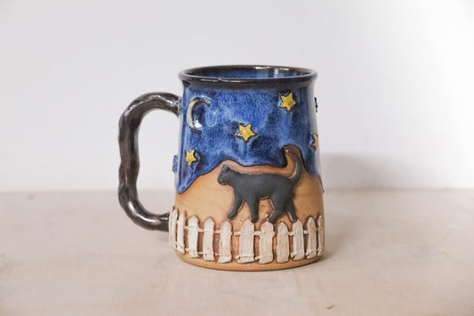 Black Cat Fence Stoneware Mug