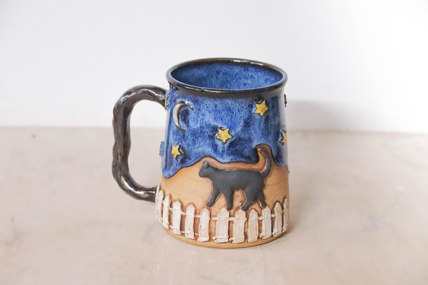 Black Cat Fence Stoneware Mug