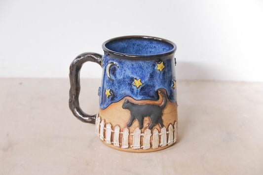 Black Cat Fence Stoneware Mug