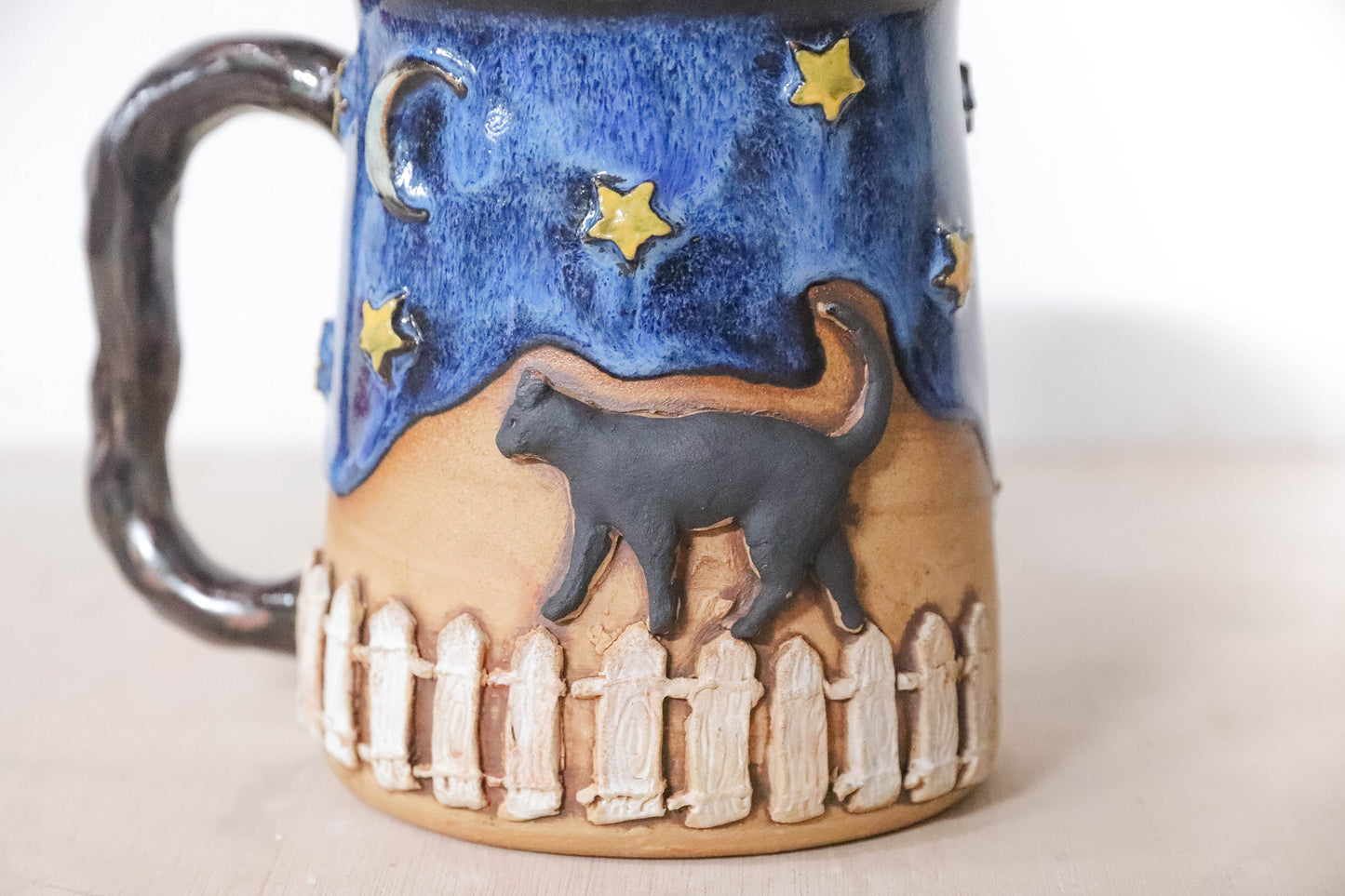 Black Cat Fence Stoneware Mug