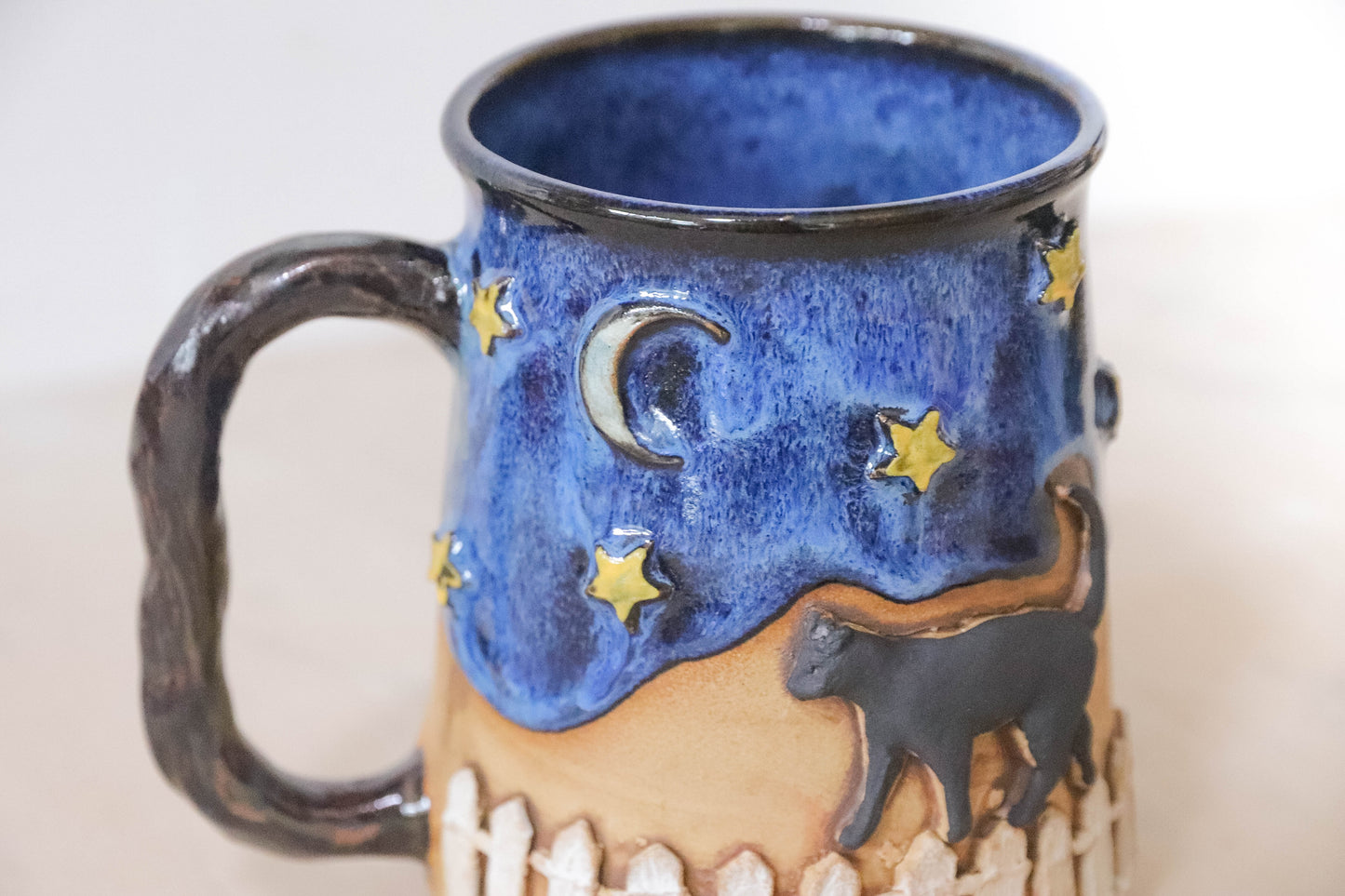 Black Cat Fence Stoneware Mug