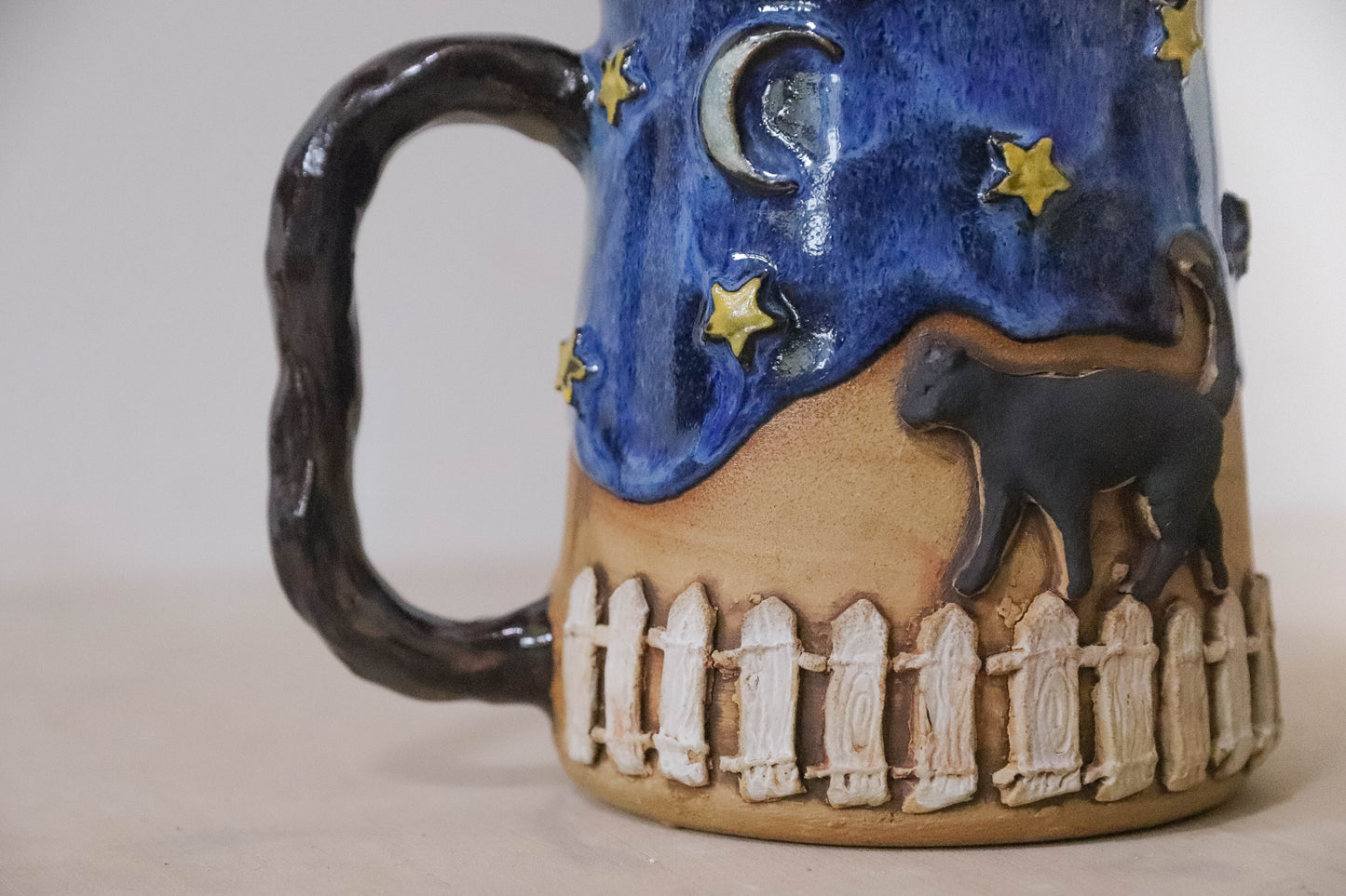Black Cat Fence Stoneware Mug