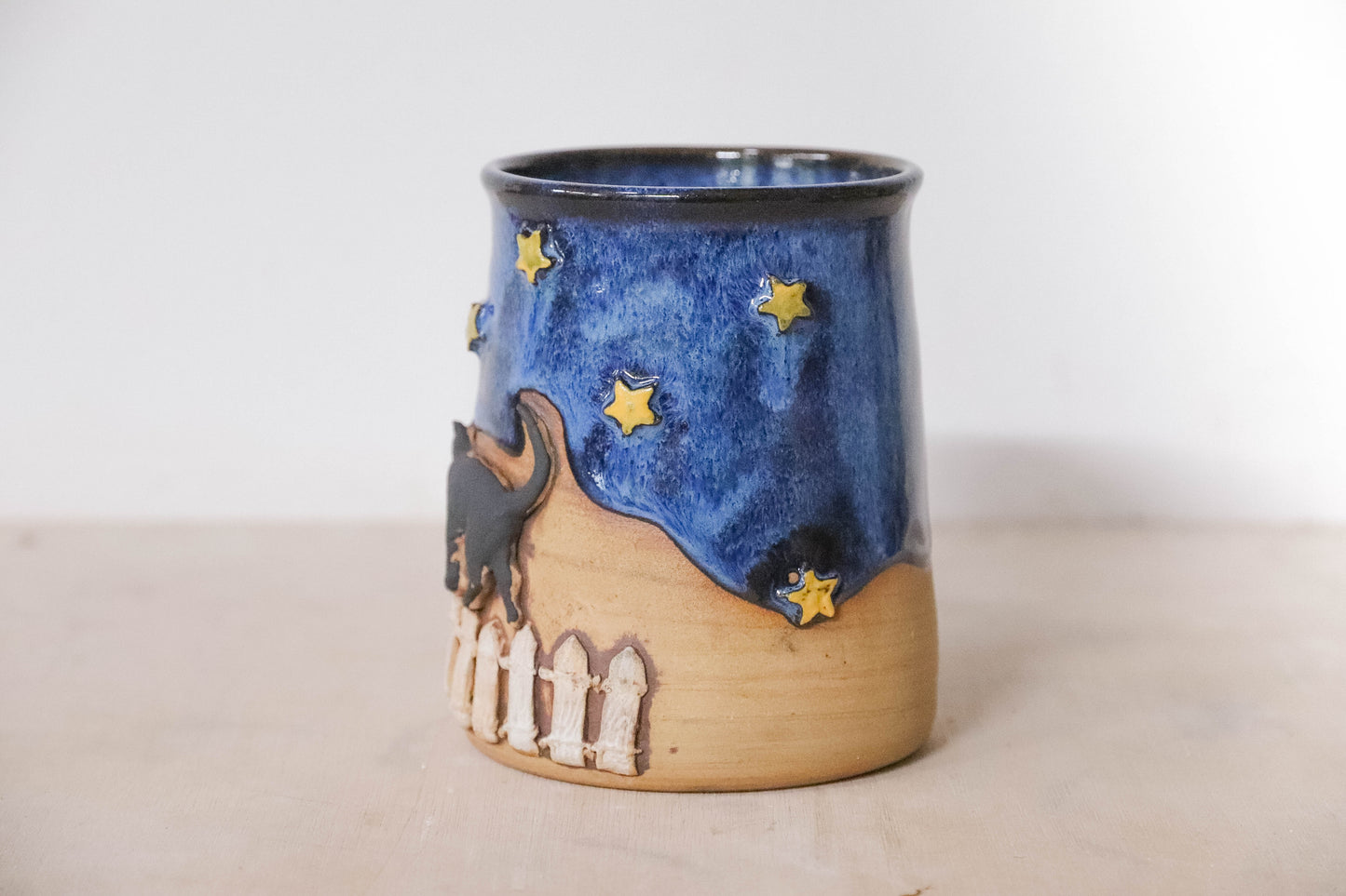 Black Cat Fence Stoneware Mug